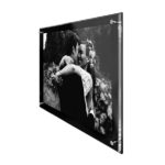 Deflecto Wall-Mounted Sign Holder – Frame Style displaying a black-and-white photo on a wall